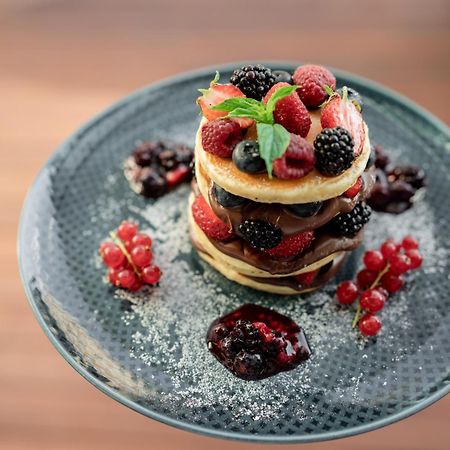 Address Istanbul Hotel Kültér fotó A stack of pancakes with fruit