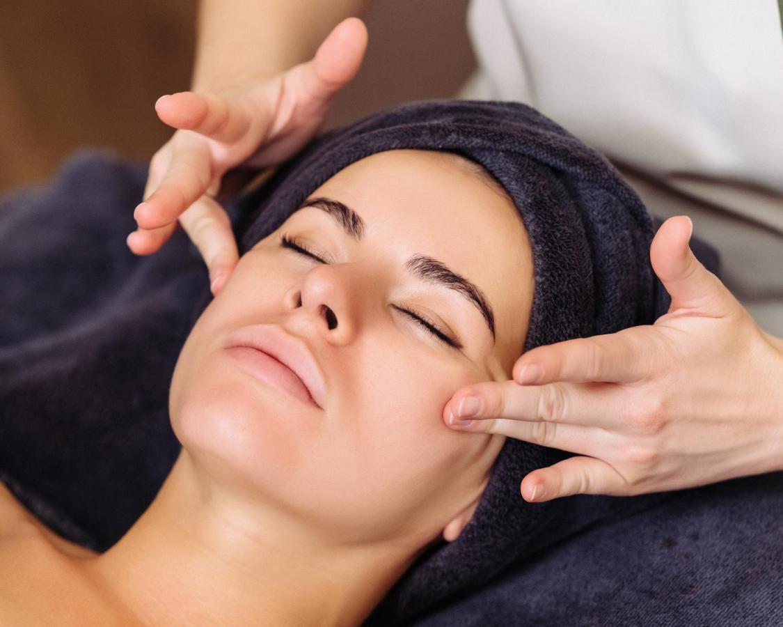 Address Istanbul Hotel Kültér fotó A woman receiving a facial massage